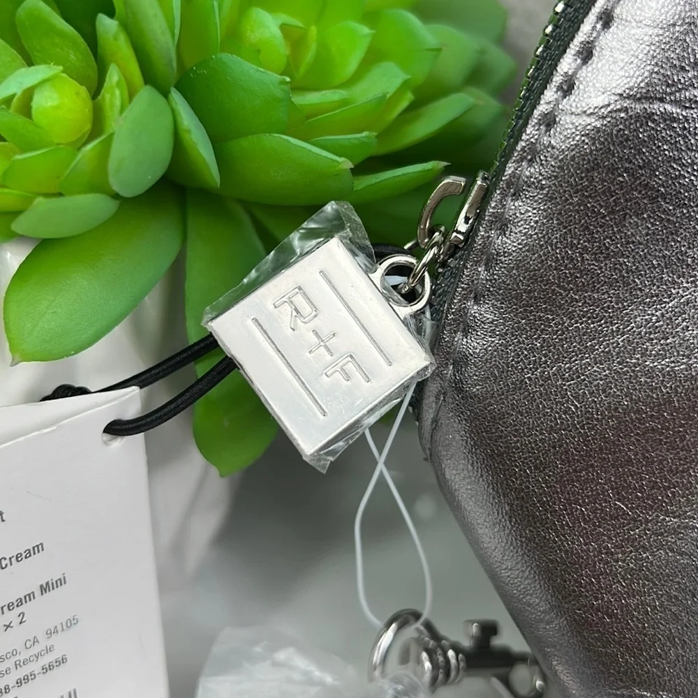 NWT Rodan + Fields Cosmetic Bag Silver with Tassel